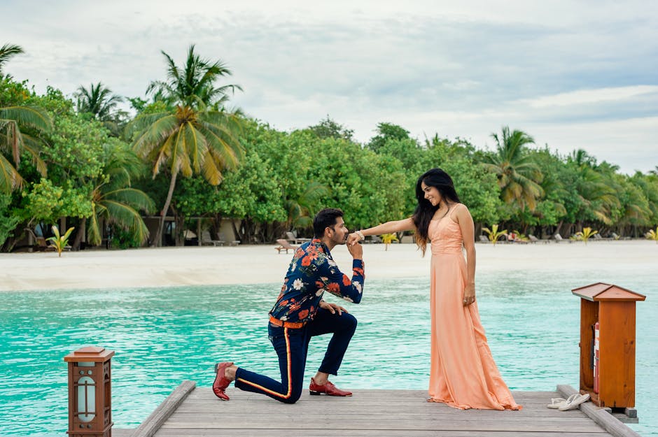 Elegant beachside proposal in Maldives with tropical backdrop; perfect couple goals